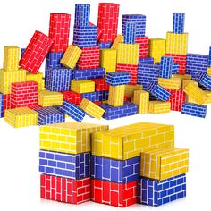 several different colored blocks stacked on top of each other in the shape of buildings and squares