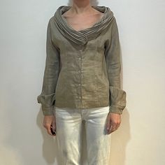 Unusual and dramatic 1990s linen shirt from avant garde designer Claude Montana.  Beautiful construction to this shirt The body has been made from a light weight beige linen with a great touch and feel. Six mother of pearl buttons on the front.  Long sleeves with one button on cuff.  Fully lined in a light weight linen.  Now! Here it gets interesting.  The collar is an enormous plisse pleated shawl. Doubled over fabric on the collar for great weight and drape.  The pleats have been sewn into the front bodice.  Darts at the waist front and back for a fitted shape.  The sleeve has been cut one with the blouse like a kimono sleeve.  Label Claude Montana. Size 42. 100% linen. Dry clean only for the plisse pleats.  Very good vintage condition with no fabric or sewing flaws. Plisse pleating has Montana Beautiful, Pleated Shawl, Claude Montana, Wool Vest, Kimono Sleeve, Mother Of Pearl Buttons, Pearl Buttons, Sweaters Oversized, Shawl Collar