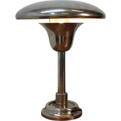 a metal table lamp with a white background