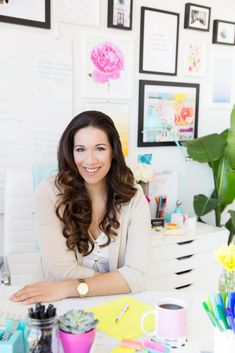 a woman sitting at a desk in an office