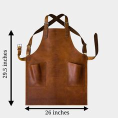 Handmade leather apron, designed for durability and comfort. Perfect for chefs, craftsmen, and artists seeking a reliable, long-lasting apron. - Free shipping on all our leather aprons. - Designed with adjustable straps to ensure a comfortable fit for various body types - Provides full coverage from neck to waist, offering protection against spills, stains, and splatters - Equipped with two spacious front pockets for convenient storage of tools, utensils, or personal items - Suitable for both kitchen and workshop environments with a sleek aesthetic - Wipeable surface makes cleaning easy, maintaining a professional appearance - Easily foldable and portable, ideal for on-the-go tasks or professionals who need to move frequently - Exterior made from genuine full-grain cowhide for long-lasting Metallic Cowhide Rug, Butcher Apron, Ropa Upcycling, Barber Apron, Patchwork Cowhide Rug, Leather Waist Bag, Real Leather Bags, Cowhide Bag, An Apron