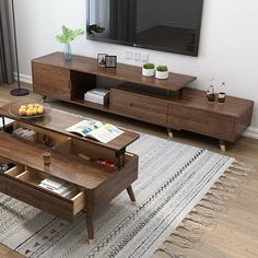 a living room scene with focus on the coffee table and entertainment center in the background