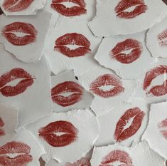 many red lipstick prints on white paper