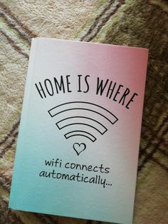 a pink and blue book with the words home is where wifi connects automatically