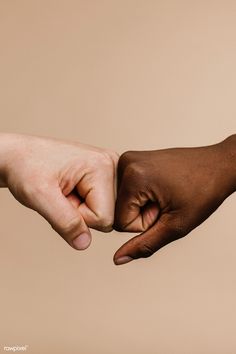 two hands reaching out towards each other in front of a beige background with the word love written on it