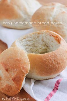 two homemade bread bowls sitting on top of a wooden table