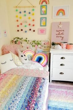 a room with a bed, dresser and colorful rugs on the floor in front of it