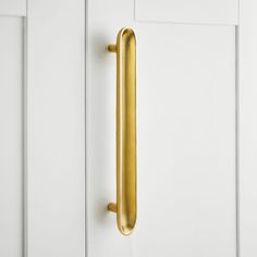 a close up of a door handle on a white door