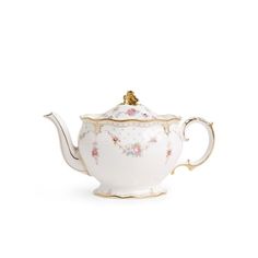 a white tea pot with gold trimmings and flowers on the top, sitting in front of a white background