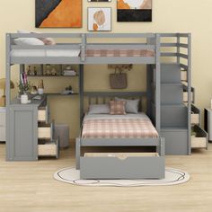 a bunk bed with stairs and desk underneath it in a room that has hardwood floors