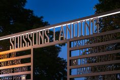 a large metal sign that says sissings andine at the entrance to a park