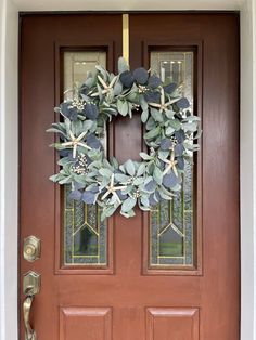 a wreath on the front door of a house