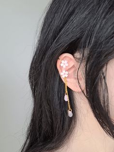 "Add something extra to your outfits with these dainty sakura ear cuffs! Made with gold plated wire, moonstones, and resin beads. The dangle length is around 6.5cm/2.5\". Each pair is lovingly handmade! One ear cuff can be worn interchangeably between both ears. You have the option to choose between: 1) Asymmetric earrings - as seen in photos (one long, one short) 2) Symmetric earrings - both of them being the long dangle version  🎀 CARE INSTRUCTIONS 🎀 * Avoid getting your jewelry wet * Avoid perfumes or sprays * Store in a cool, dry place" Crystal Car Charms, Asymmetric Earrings, Pink Sakura, Crawlers Earrings, Ear Cuffs, Resin Beads, Quartz Earrings, Copper Earrings, Cuff Earrings