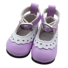 a pair of purple shoes with white laces on the bottom and one shoe has a metal buckle