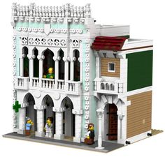 a lego model of a building with people standing outside