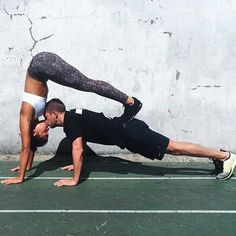 two people doing push ups on their stomachs