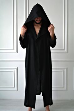 "HOODED LINEN ROBE for MEN, HANDMADE LINEN ROBE This robe is a very cozy and comfortable wear. Take it with you on vacation, a business trip or to a SPA - and you will always feel at home:) The robe features: - Front wrap - Hood - Long sleeves with lapels - Belt - Two inseam pockets - Ankle length It is made of pure organic European linen which is soft, breathable and pleasant to the skin. It keeps you cool in hot weather and makes you feel warm and cozy on cooler days. COLOR: pitch black. Also Black Winter Loungewear Robe, Winter Black Robe For Loungewear, Black Long Sleeve Robe For Loungewear, Black Long Sleeve Robe For Fall, Robe For Men, Linen Outfits, Linen Robe, Bathrobe Men, Garment Fabric