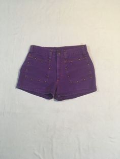 "1960s purple denim jean shorts label- h.i.s. for her, 'don't envy h.i.s... wear them' cotton feel burnished metal rivet studs detail TALON metal zipper snap top 2 front pockets5 belt loops back waist darts good vintage condition, small pocket seam repair, light wear, as photos show no size tag see below measures, lying flat, waist-14\" rise-10\" inseam-2 1/4\" hem-10\" outseam-11" Fitted High Waist Cotton Jean Shorts, Fitted Jean Shorts With Belt Loops For Spring, Trendy Fitted Cotton Shorts, Fitted High-waist Cotton Jean Shorts, Retro High Rise Fitted Jean Shorts, Vintage Fitted Bottoms For Festival, Fitted High Rise Jean Shorts With Belt Loops, Fitted Jean Shorts For Summer Festivals, Trendy High Waist Jean Shorts For Festival