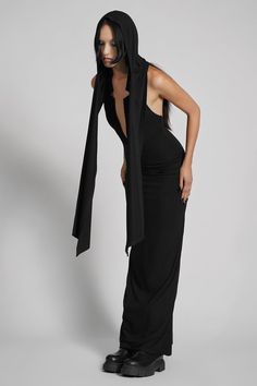 Make them take a second glance. Maxi dress made from luxuriously dense Jersey, featuring an add-on hood that can be draped across the shoulders and over the crown of the head, with plunging halter top neckline. FIT NOTES:Tatianna wears a size Small, 5'9, with a 26" waist.MATERIALS:95% rayon 5% spandexMade in China Hood Dress, Top Neckline, Low Neckline, Hooded Dress, The Crown, Halter Top, Dress Making, Take That, Crown