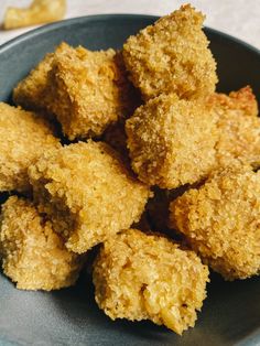 some fried food in a blue bowl on a table