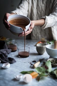 a person pouring chocolate into a bowl