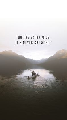 a man in a boat on the water with mountains behind him and an inspirational quote above it