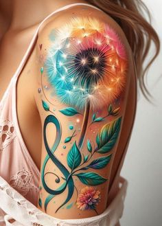 a woman's arm with colorful tattoos and flowers on the back of her shoulder