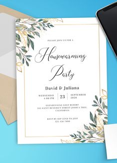 an elegant wedding party card with greenery and gold foil on it, next to a phone