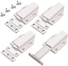 four white cabinet door latches with screws on the bottom and one in the middle