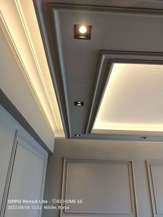 the ceiling in this kitchen has been painted white and is lit by an overhead light