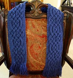 a chair with a blue scarf on top of it