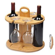 three wine glasses and two bottles in a wooden holder