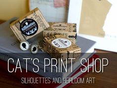 cat's print shop supplies displayed on top of books with the caption catsprint shop silhouettes and heiroom art