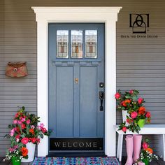 a blue door with two flower pots on the front porch and one pink boot next to it