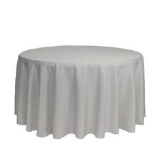 a round table with white cloth on it