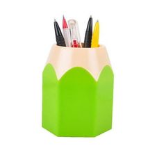 a pencil holder with pens and markers in it