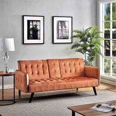 a living room scene with focus on the couch and coffee table in the foreground