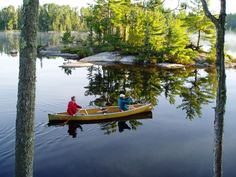 two people in a canoe on the water