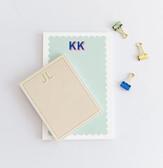 the letter j is for kk and it's next to some clips that have been placed on top of each other