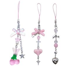 three key chains with charms attached to them, one is pink and the other is silver