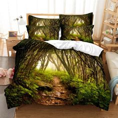 a bed with a forest scene on it