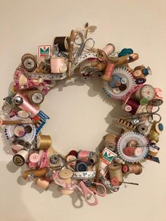 a wreath made out of various sewing items