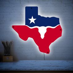 the texas state is lit up in red, white and blue with a star on it