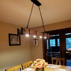 a dining room table with flowers on it