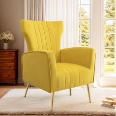 a yellow chair sitting on top of a white rug