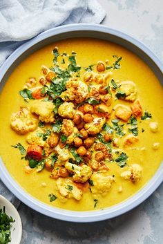 a bowl of soup with cauliflower and chickpeas