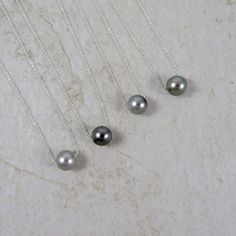 Genuine Tahitian Pearl Necklace~ This elegant necklace has a beautiful genuine Tahitian pearl floating on fine sterling silver chain. Pearl is approx. 9mm. - 10mm. *Check out the diagram in the last picture to help you decide on the length of chain you would like. **Each pearl will vary in size, shape and color and may have natural blemishes. Also available in gold~ https://www.etsy.com/listing/210571496/tahitian-pearl-necklace-gold-chain?ref=shop_home_active_3 Shop~ http://www.etsy.com/shop/Han Black Wedding Jewelry, Peacock Pearls, Tahitian Pearl Necklace, Black Pearl Necklace, Pearl Necklace Designs, Black Pearls, Tahitian Black Pearls, Gold Pearl Necklace, Statement Jewellery