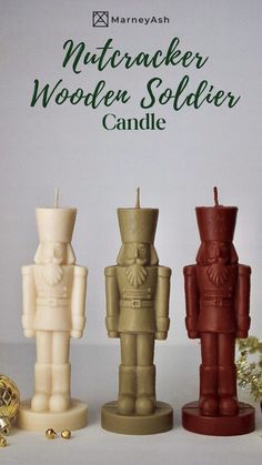 three wooden soldier candles sitting next to each other on top of a white tablecloth