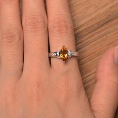 It is a natural citrine ring. The main stone is 5mm*10mm marquise cut, weight about 0.87 carats. The basic metal is sterling silver and plated with rhodium. To change the metal to a solid gold (white/rose) or platinum is also available, please ask for a quotation if you want. You can also go to my shop Home for more elegant rings: https://www.etsy.com/shop/godjewelry?ref=hdr_shop_menu More citrine rings: https://www.etsy.com/shop/godjewelry?search_query=citrine Customization is always welcome an Marquise Topaz Jewelry For Anniversary, Yellow Marquise Cut Jewelry For Anniversary, Peridot Birthstone Ring, Engagement Ring Marquise Cut, Citrine Engagement Ring, Engagement Ring Marquise, Citrine Ring Engagement, Peridot Engagement Rings, Blue Aquamarine Ring