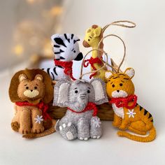 a group of stuffed animals sitting next to each other on top of a white table